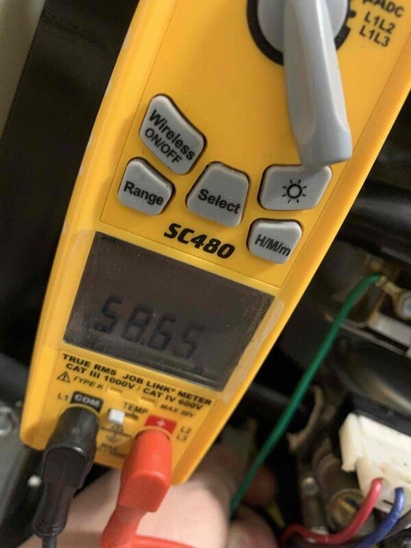 Diagnosed furnace issue for Ms. Bucco where unit was running but only producing cold air. Testing with Fieldpiece SC480 multimeter revealed voltage readings of 586.5V, and inspection of the EMERSON control board showed error code E2.1, indicating control board failure. Replaced defective control board to restore proper heating function.
