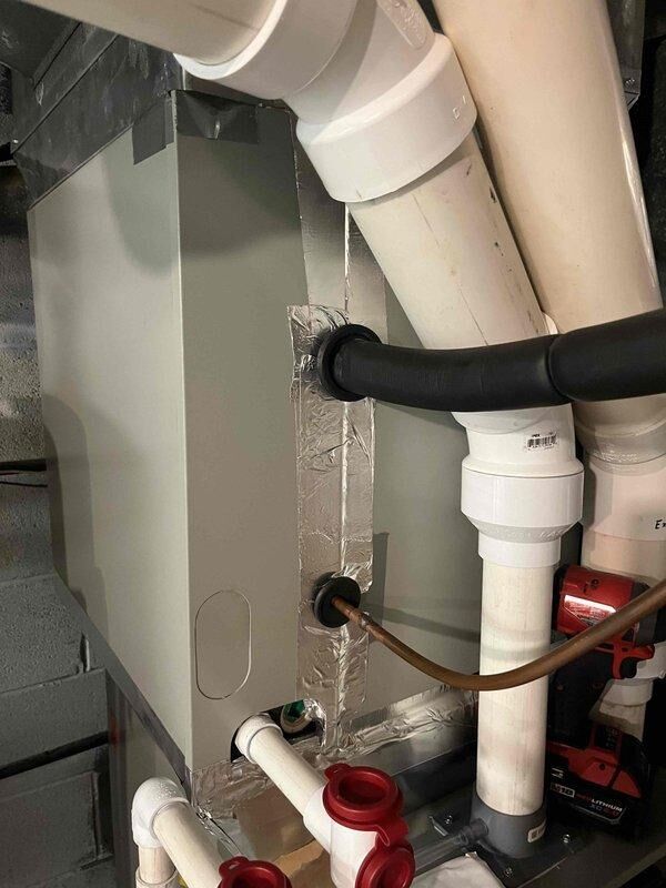 Responded to customer report of rattling noise in recently installed furnace system. Inspected unit and connections, noting system is heating properly. Applied foil tape to secure connection points and eliminate the source of the rattling noise.