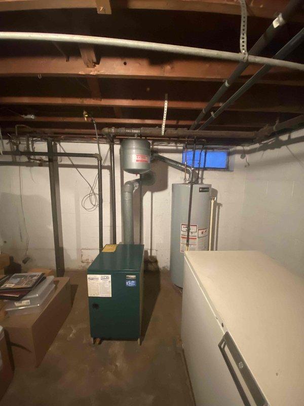 Conducted on-site inspection of 41-year-old inoperative gas boiler serving baseboard heating system. Evaluated existing installation in unfinished basement, documenting current configuration including connection points, piping condition, and associated components. Provided comprehensive replacement estimate for this aging unit that failed during operation the previous night.