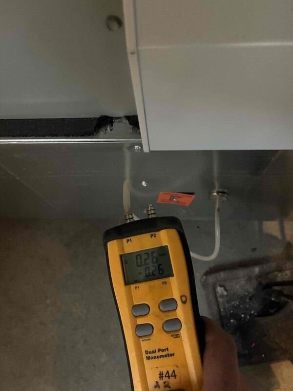 Perry, OH - Completed routine cooling maintenance on air handler unit 2 as part of club membership service. Performed diagnostic measurements using dual port manometer to verify proper system pressures and airflow, with readings indicating normal operating parameters at 0.05 and 8.4 respectively.