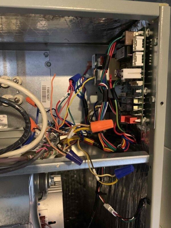 Responded to a no-heat callback following an AC startup service. Upon inspection, discovered evidence of significant heat damage and charring on wooden components within the HVAC cabinet, along with discolored wiring connections. Assessed electrical control panel, contactors, and circuit breakers for proper operation and safety concerns. Reviewed system wiring diagrams to verify proper thermostat and stage control connections for heat pump operation. Restored heating functionality and documented damaged components for follow-up recommendations.