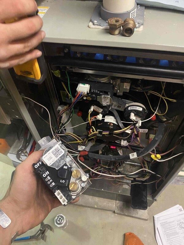 Returned to property to replace defective gas valve under warranty. Removed and replaced faulty gas valve assembly, verified all electrical connections, and tested system operation. Performed combustion analysis using manometer to confirm proper gas pressure readings at 1.15 INWC, ensuring safe and efficient operation of heating unit.