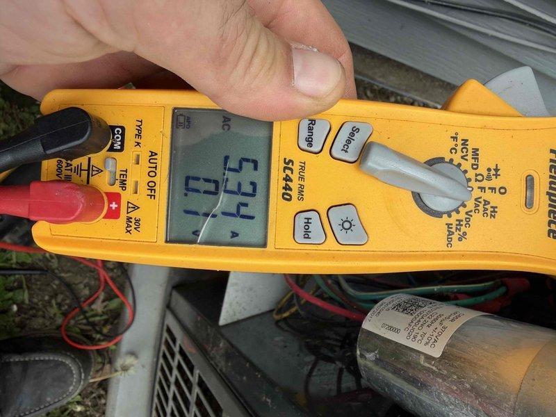 Completed comprehensive tune-up on 9-year-old residential air conditioning system. Performed electrical diagnostics using digital multimeter, measuring voltage at 17.3V and amperage at 0.63A to verify proper compressor operation. Inspected all electrical connections, capacitor, and wiring. System operating within normal parameters with no deficiencies noted.