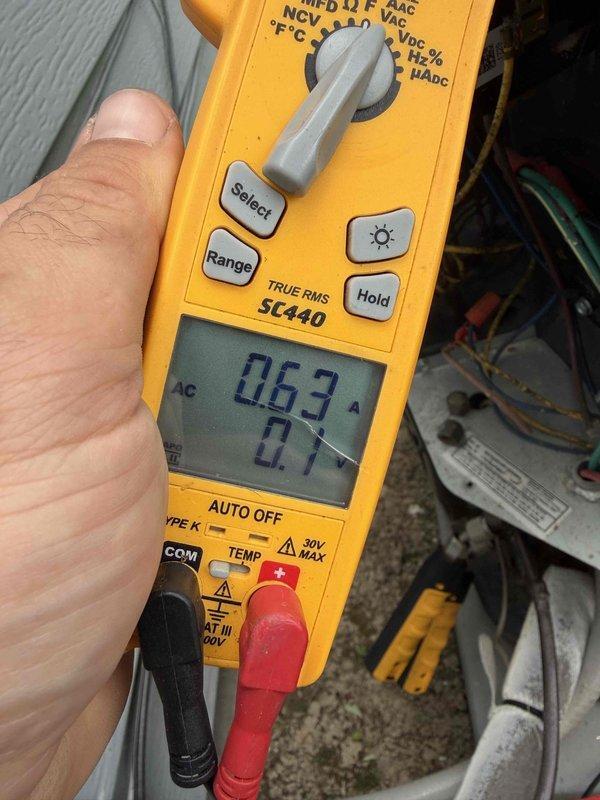 Completed comprehensive tune-up on 9-year-old residential air conditioning system. Performed electrical diagnostics using digital multimeter, measuring voltage at 17.3V and amperage at 0.63A to verify proper compressor operation. Inspected all electrical connections, capacitor, and wiring. System operating within normal parameters with no deficiencies noted.
