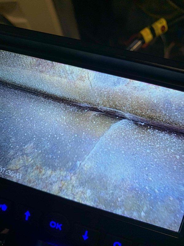 Pepper Pike, OH - Performed inspection of secondary furnace heat exchanger utilizing borescope camera following recent replacement of primary unit. Visual examination revealed possible condensation and a horizontal crack in the heat exchanger surface, documented with digital imagery for assessment.