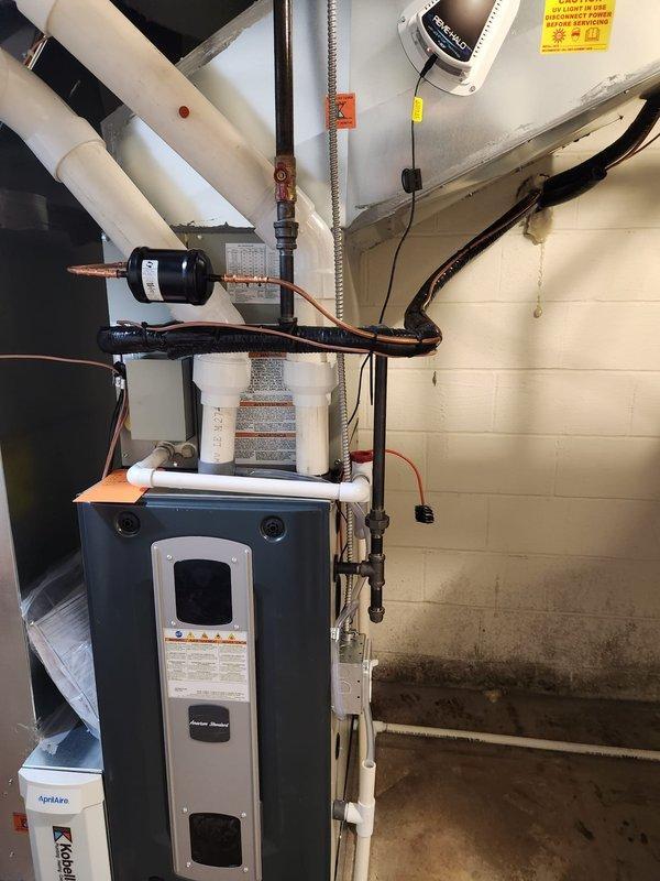 Completed installation of new HVAC system in basement utility room, which included mounting the furnace unit with PVC ventilation piping, connecting insulated copper lines, and installing all necessary control components. Performed pressure testing with Fieldpiece Dual Port Manometer, confirming readings of 009/007, and verified proper installation of PRIMEHALO monitoring equipment for optimal system performance.