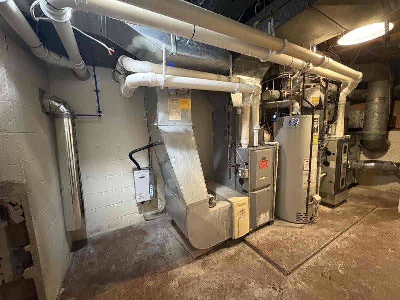 Returned to property for tankless water heater installation previously sold by Justin. Completed installation of unit in basement mechanical room, connecting to existing PVC venting system. System was properly mounted, plumbed, and tested for operation with appropriate clearances maintained from other mechanical equipment.