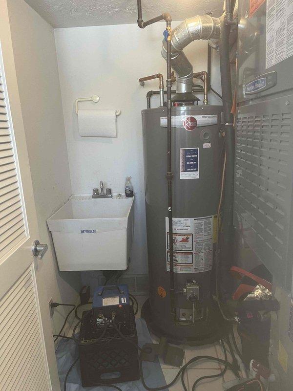 Responded to service call for no hot water in the residence. Diagnosed frozen water supply lines affecting the water heater system located in the utility closet. Thawed affected pipes using approved methods, restored water flow, and verified proper operation of the 5-year-old water heater unit. System now functioning correctly with normal hot water supply throughout the home.