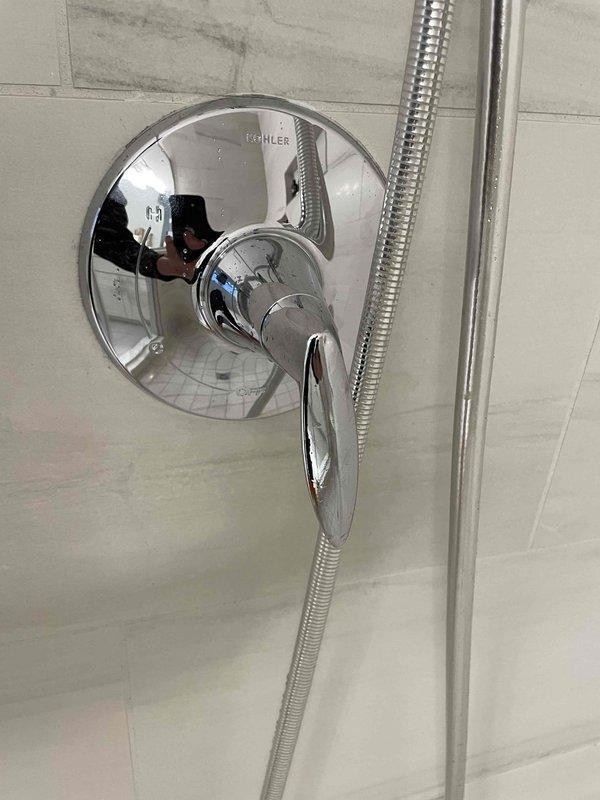 Pepper Pike, OH - Returned to install special Kohler trim kit for shower fixture. Verified proper mounting of chrome fixture with lever handle on tiled bathroom wall. Awaiting additional materials to complete installation.