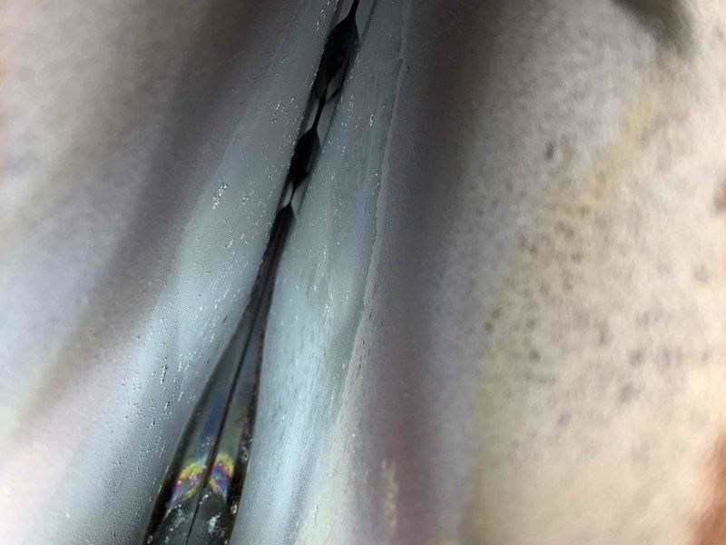 Performed diagnostic assessment on newly installed AC system at customer's request due to installation concerns. Conducted pressure testing using gauge set on service valves and inspected refrigerant lines, noting condensation on suction line. Unable to complete full startup procedure due to ambient temperature conditions below recommended threshold for proper system evaluation.