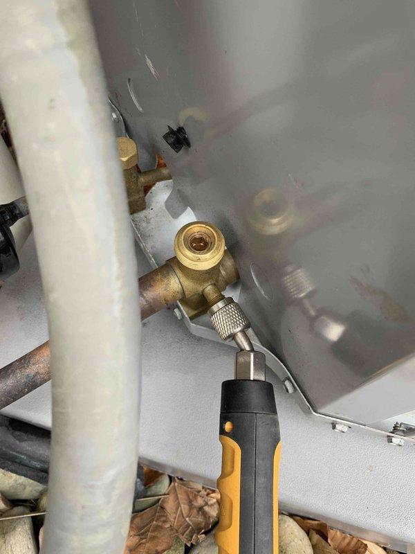 Performed diagnostic assessment on newly installed AC system at customer's request due to installation concerns. Conducted pressure testing using gauge set on service valves and inspected refrigerant lines, noting condensation on suction line. Unable to complete full startup procedure due to ambient temperature conditions below recommended threshold for proper system evaluation.