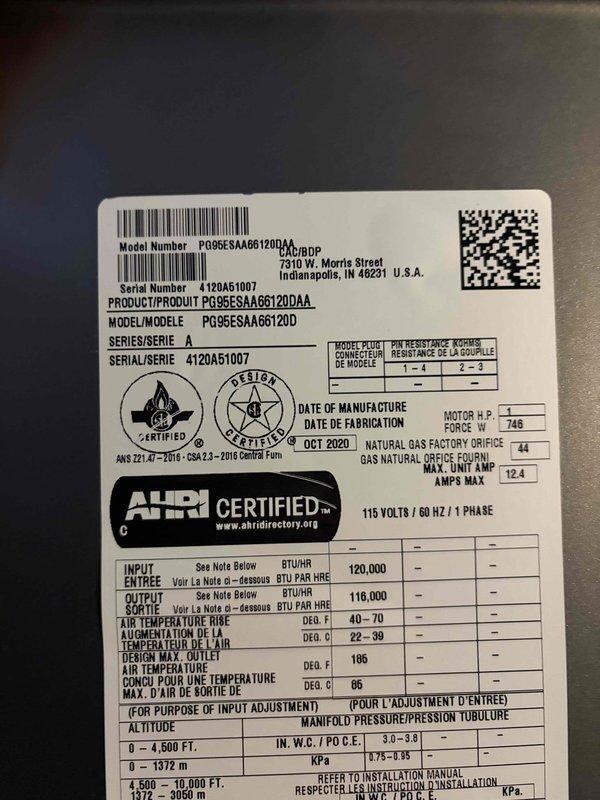 Chardon, OH - Responded to no cooling complaint on residential HVAC system with unit blowing lukewarm air. Upon arrival, confirmed refrigerant leak present in system. Documented equipment specifications showing Goodman furnace model PG95ESAAG6120DAA manufactured October 2020 with 120,000 BTU input capacity. Advised system shutdown to prevent compressor damage until refrigerant leak can be located and repaired.