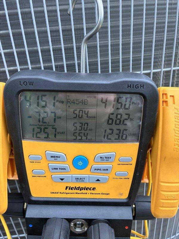 Returned to complete previously sold repair work on HVAC system. Connected refrigerant manifold gauge set to system and performed diagnostic pressure and temperature readings on both high and low side service ports. Verified system pressures and superheat/subcooling measurements using digital SMAN gauge to ensure proper refrigerant charge and system operation. Completed testing and confirmed system operating within manufacturer specifications.