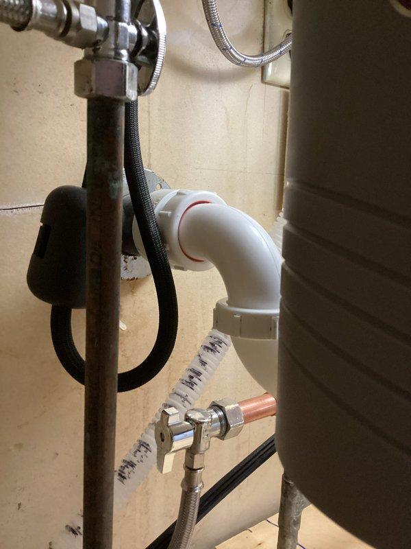 Responded to water leak under kitchen sink following recent remodel. Upon inspection, identified leaking connection at PVC drain elbow joint and loose fitting on chrome shut-off valve supplying flexible braided water line. Tightened all connections, replaced worn compression fittings, and secured drain assembly to eliminate leak points. Tested system under full water pressure to verify repair integrity and confirmed no active leaks present. All plumbing connections now functioning properly with no moisture detected.