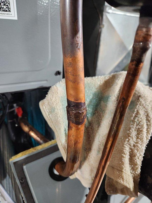 Returned to address installation issues on HVAC system. Replaced outdoor coil due to severe corrosion and deterioration on copper piping. Installed pan heater as required. Removed shipping bracket from under sound blanket on compressor that had been left in place during initial installation. Completed system startup and verified proper operation of all components.
