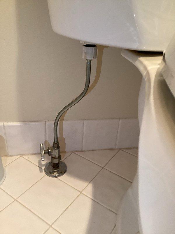 Responded to a leak around the base of a toilet in a 40-year-old residence. Upon inspection, identified the issue stemming from a deteriorated wax ring seal between the toilet and the floor flange. Shut off the water supply at the floor-mounted angle stop valve and disconnected the chrome supply line from the tank fill valve. Removed the toilet by unbolting it from the floor flange, then scraped away the old wax ring residue from both the toilet base and the closet flange. Inspected the flange for damage and confirmed it was secure and in acceptable condition. Installed a new wax ring with plastic horn onto the flange, carefully repositioned the toilet to ensure proper alignment with the mounting bolts, and compressed the seal by applying even pressure. Reinstalled and tightened the closet bolts to manufacturer specifications, being careful not to over-torque and risk cracking the porcelain. Reconnected the water supply line, opened the angle stop valve, and filled the tank. Conducted 